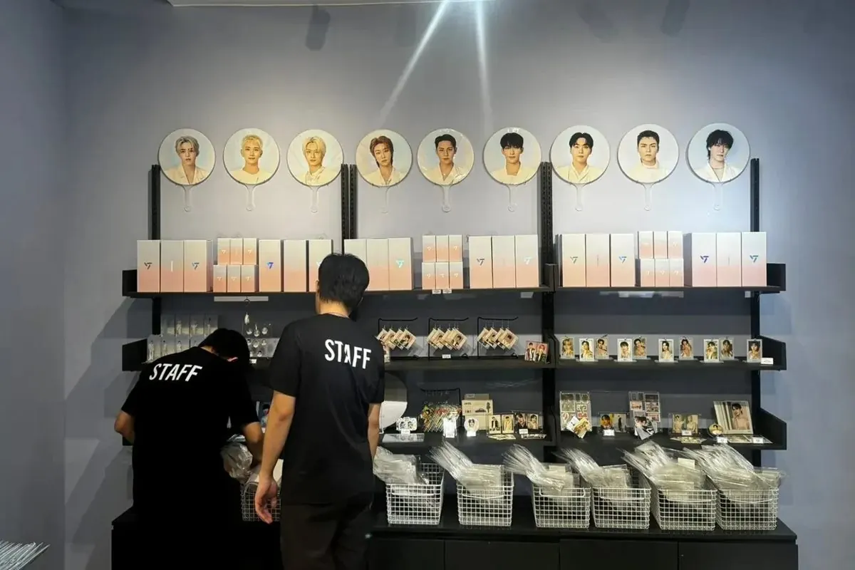 SEVENTEEN merch wall with image picket fans, albums and photocards